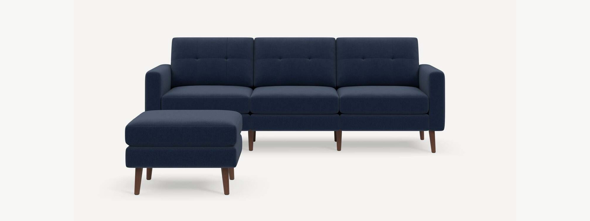 Burrow Nomad Plus sofa and separate ottoman in Navy Blue